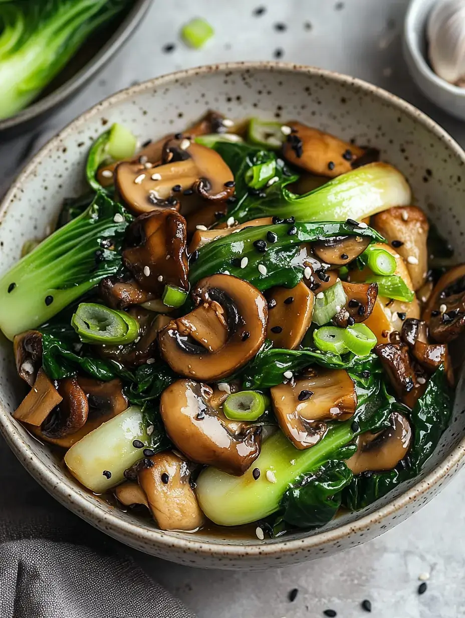 A bowl of sautéed bok choy and mushrooms garnished with green onions and sesame seeds.