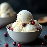 Bowl of ice cream with berries.