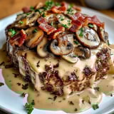A plate of food with mushrooms and bacon.