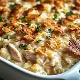 A white bowl filled with a delicious dish.