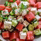 A bowl of watermelon and feta cheese.